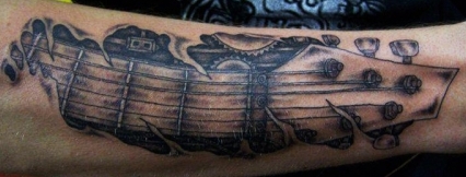 West Coast Tattoos' Black & Grey work by Blan. Guitar arm.