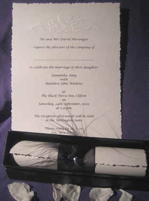 Scroll invitations with embossed design with feather and heart detail on the ribbon band. The colours can be changed to suit your own colour scheme.