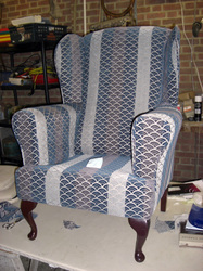 Wing arm chair reupholsterd with legs back on