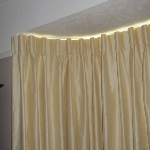 Made to measure cartridge pleats in a silky Villa Nova fabric in Goring by Sea.  Fitted on a reverse bent track in a bay window