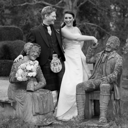 Bride and groom and statues at Fingask Castle, Perthshire