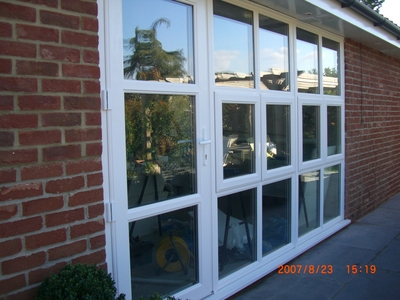 Modern design three sectional window with door in Suffolk