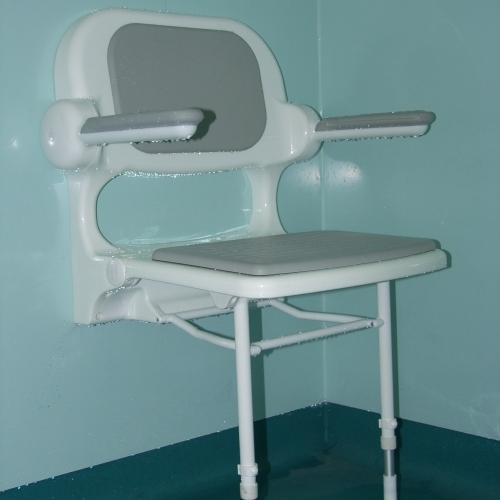 Padded shower seat. Foldaway arms and seat.