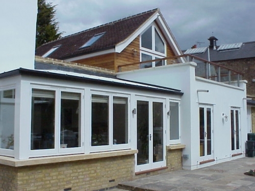 Bespoke design extension to listed building with sailloft and featured car turntable and automated garage door system